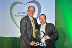 Winner of the National Community Hero Award 2014 Adrian Emmett collecting trophy