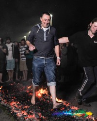 charity firewalk man walking on hot embers to raise money for Peace Hospice Care Watford Mark In Time Photography events