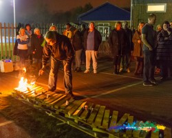 fire being lit for a charity firewalk mark in time photography
