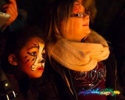 Charity firewalk in aid of the peace hospice watford facepainted girl watching the action
