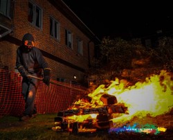 Firewalk staff making the fire